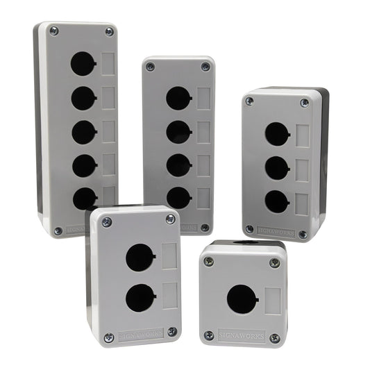 Set of five grey and black electrical boxes with different numbers of sockets on a white background.